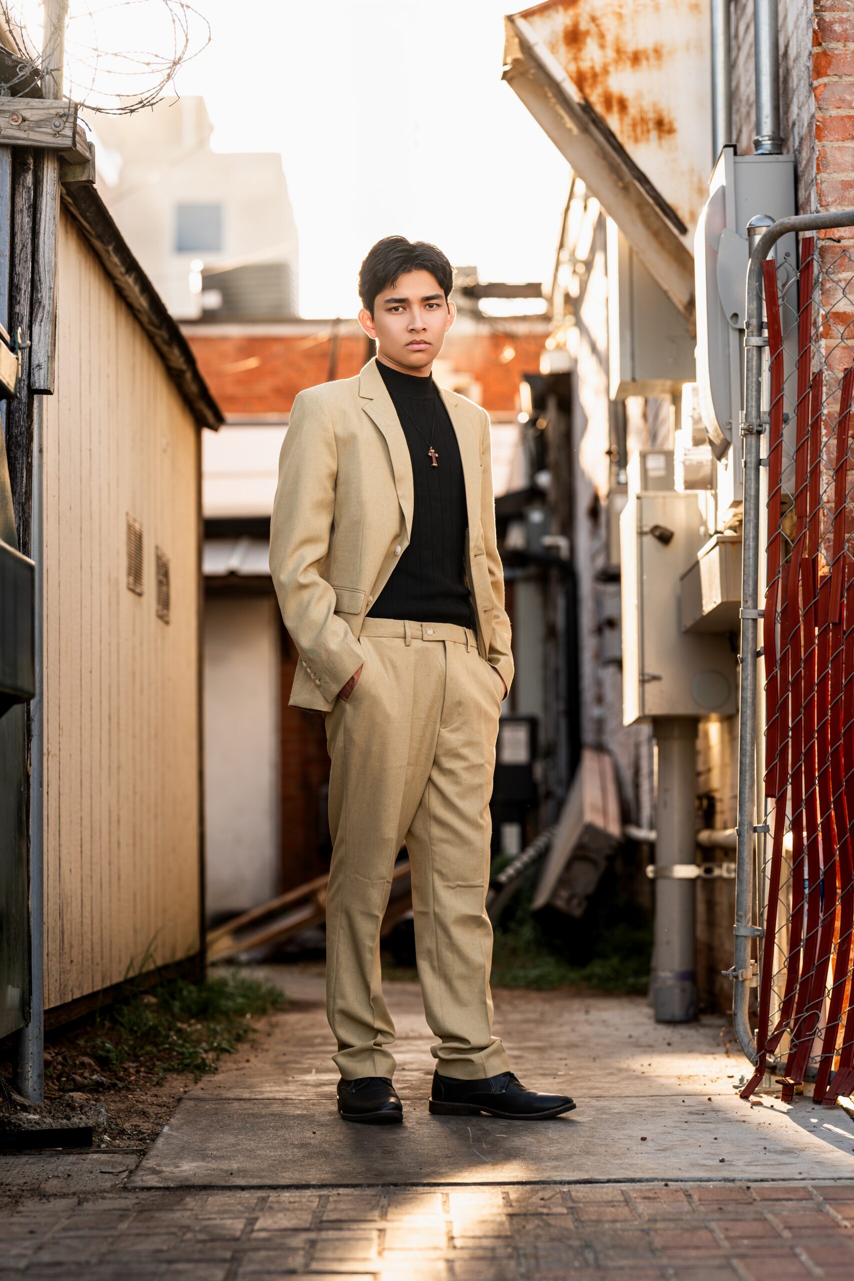 A picture of a high school senior during his senior portrait session.