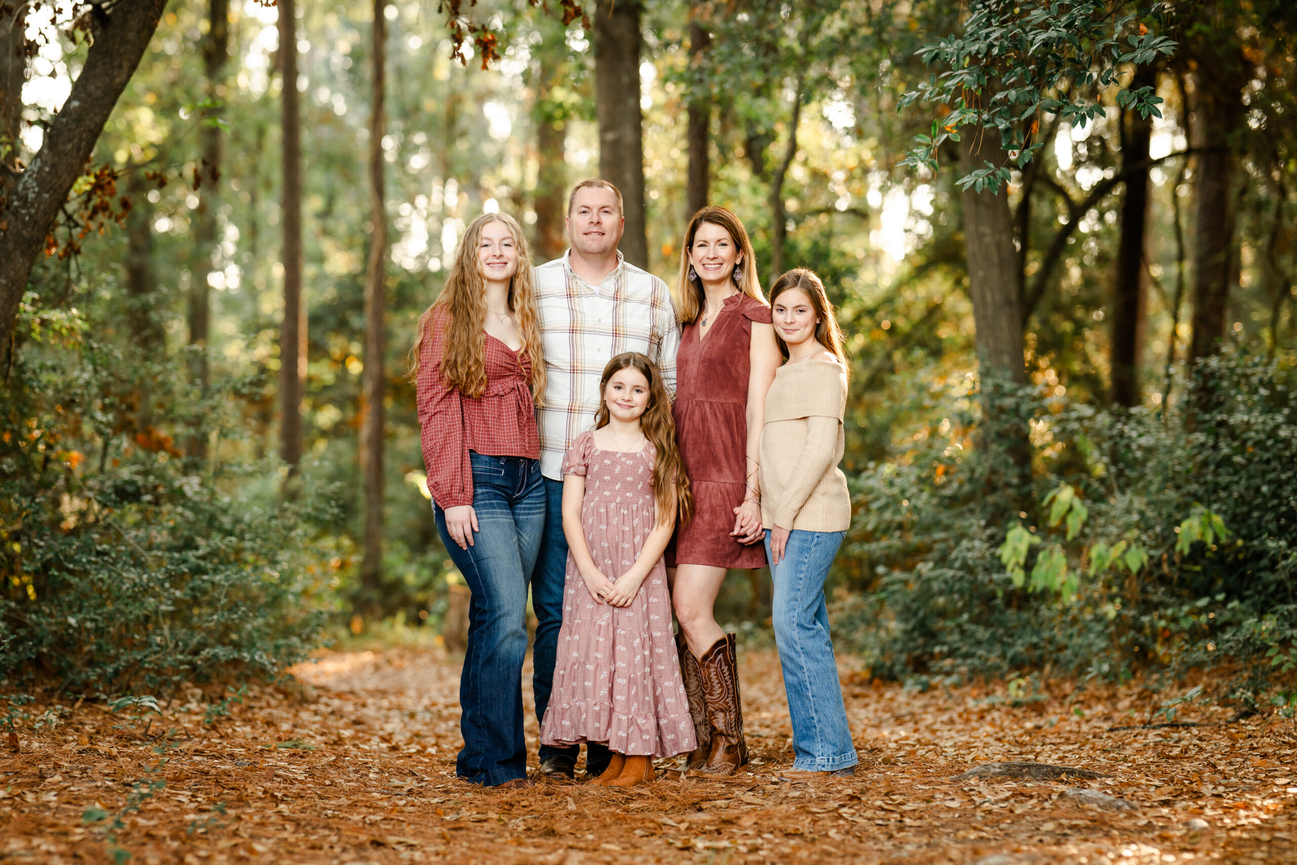 Picture of a family standing in a forest near Shenandoah, Texas.